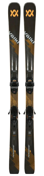 Black and orange Völkl skis with bindings, featuring a sleek design and durable construction for performance.
